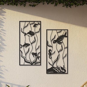 May include: Two black metal wall art panels depicting underwater scenes with fish and seaweed. The panels are rectangular and mounted on a white wall. The balcony features hanging lanterns, potted plants, and a woven chair, creating a relaxing outdoor space.