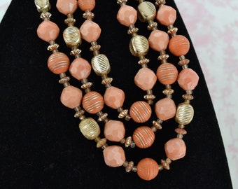 Vintage Necklace with Three Strands of Plastic Peach and Muted Orange and Gold Beads Made in Western Germany