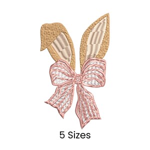 May include: Embroidered design of bunny ears and a bow. The ears are tan with a textured look, and the bow is pink and white. The text "5 Sizes" is below the design, indicating available sizes for the embroidery.