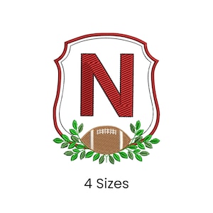 May include: Embroidered design featuring the letter "N" in red, set within a white and red shield shape. A football and green leaves are at the bottom. The text "4 Sizes" is below the design.
