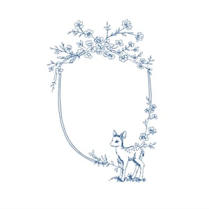 May include: A blue embroidered design featuring a deer inside an oval frame. The frame is decorated with floral and leaf accents. The deer is standing on a patch of grass. The design is on a white background.