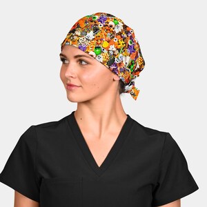 May include: A colorful Halloween-themed scrub cap featuring a vibrant pattern of candy corn, eyeballs, ghosts, and other spooky elements. The cap is tied at the back and is worn by a person wearing a black scrub top.