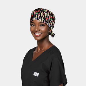 May include: A white ceramic mug with a black handle and the text "But First, Coffee" in a bold, black font. The mug is set against a neutral background, highlighting its simple design.