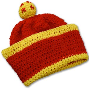 May include: Red and yellow crocheted hat with a yellow star pom-pom.