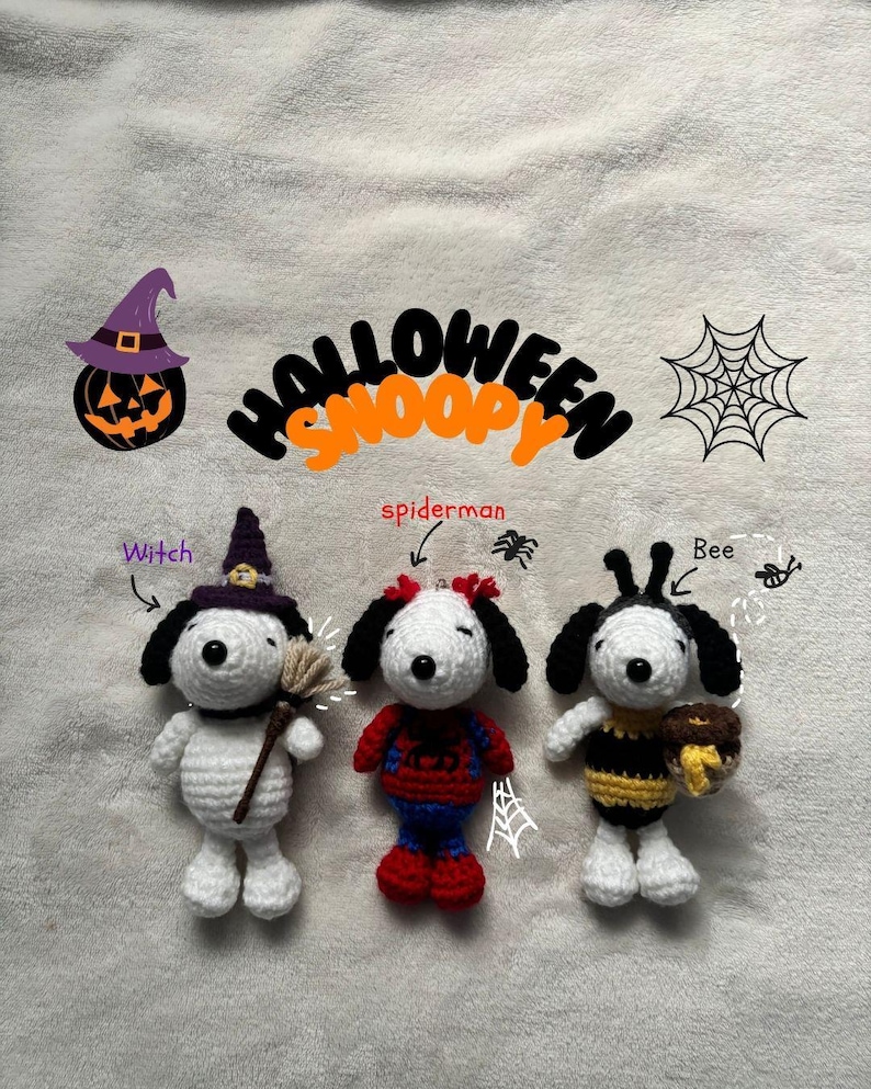 May include: Crocheted Snoopy figures dressed as a witch, Spiderman, and a bee. The figures are white with black ears and are holding a broom, a web, and a honey pot. The word "Halloween Snoopy" is written above the figures.