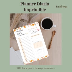May include: A printable daily planner with floral accents and the text "Planner Diario Imprimible." The planner includes sections for scheduling, priorities, and notes. A cup of coffee and a wooden spoon are on the table.