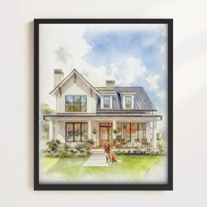 May include: Watercolor painting of a white farmhouse with a black roof and a wraparound porch. A golden retriever sits on the green lawn in front of the house. The sky is blue with fluffy white clouds. The artwork is framed in a black frame.