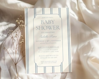 May include: A baby shower invitation with a cream background and light blue vertical stripes. The invitation features the text "BABY SHOWER" in a decorative frame, along with event details, including the date, time, and location.