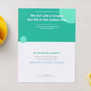 May include: A white and teal workbook titled We Act Like a Couple. But We're Not Called One. The cover features the subtitle A Clarity Workbook for the Relationship That Exists But Has No Name, with additional text Are We Actually Together? and small buttons.