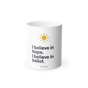 May include: White ceramic mug featuring a yellow sun design and the words "I believe in hope. I believe in belief." The mug also includes the hashtag "#SeriesQuotes".