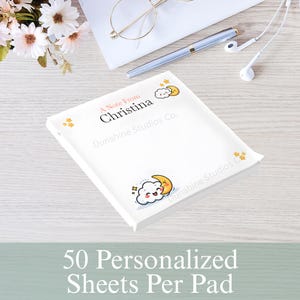 May include: A white notepad with the text "A Note From Christina" and a cartoon cloud and moon design. The notepad also has the text "Dunshine Studios Co." and "50 Personalized Sheets Per Pad".