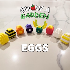 May include: A collection of colorful, pixelated egg-shaped objects. The eggs are in various colors, including yellow, black, orange, purple, green, red, white, and yellow. The text "GROW A GARDEN" and "EGGS" are displayed above and below the eggs.