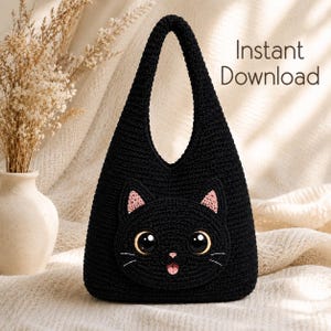 May include: A black crocheted handbag featuring a cat face design with large dark eyes, pink inner ears, a small pink nose, and a pink tongue. The bag has a single integrated handle and the text Instant Download is printed in the upper right corner.