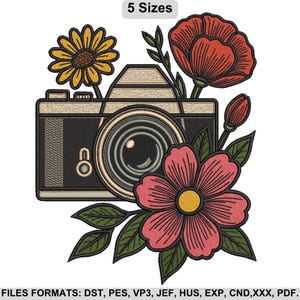 May include: An embroidered design featuring a vintage camera with a lens, surrounded by colorful flowers and leaves. A yellow sunflower, a red poppy, and a pink flower are included. The text "5 Sizes" is at the top.