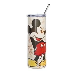 May include: A tall, cylindrical stainless steel tumbler featuring a graphic of Mickey Mouse in his signature red shorts and yellow shoes. The background has a light beige tone with faint, sketch-like character outlines. It includes a clear lid and a metal straw.