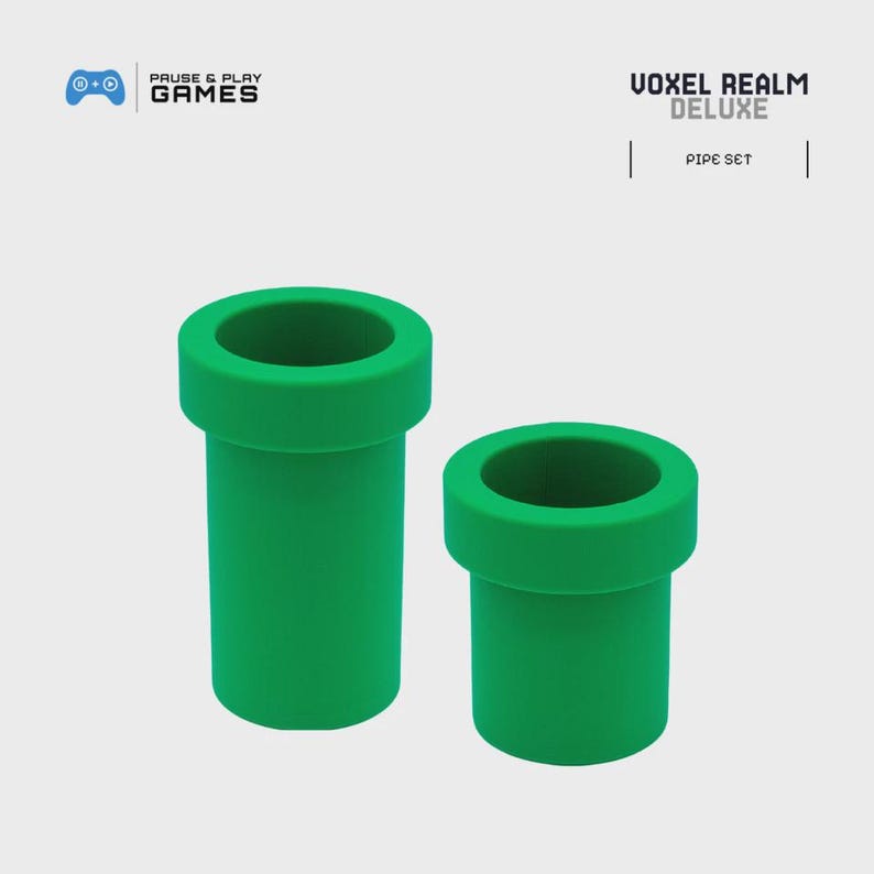 May include: Two green pipe-shaped objects, one larger than the other, are displayed against a light background. The pipes have a classic design, with a wide rim at the top. The text "VOXEL REALM DELUXE" and "PIPE SET" are visible.