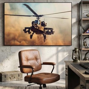 May include: A home office with a large framed picture of a helicopter in flight. The room features a brown leather office chair, a wooden desk, and metal shelving with military-themed decor, including a helmet and a flag.