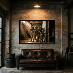 May include: A framed wall art print depicting a group of four soldiers in tactical gear and helmets, holding rifles while positioned in a dusty, sunlit industrial warehouse with large windows and exposed concrete walls and beams.
