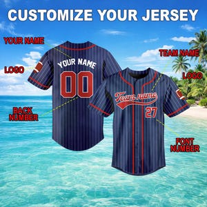 May include: Two navy blue baseball jerseys with red and white accents. One jersey has the text "YOUR NAME" and the number "00". The other jersey has the text "Team name" and the number "27". The image includes the text "CUSTOMIZE YOUR JERSEY".