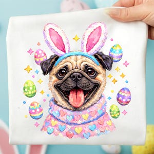 May include: A white square fabric featuring a watercolor illustration of a pug wearing bunny ears and a sweater. The pug is surrounded by Easter eggs and star shapes. The pug has a pink tongue sticking out.
