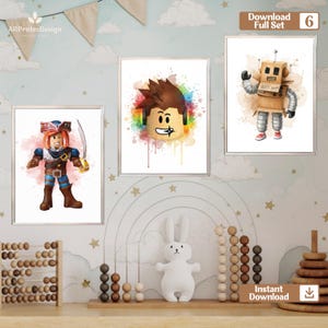 May include: Three framed watercolor prints featuring cartoon characters. One shows a pirate with a sword, another a character with rainbow accents, and the third a robot made of cardboard. The prints are displayed in a child's room.