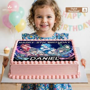 May include: A pink frosted birthday cake with a colorful anime design and the words "HAPPY 5TH BIRTHDAY DANIEL". The cake is held by a young girl in a floral dress, with balloons and a "HAPPY BIRTHDAY" banner in the background.