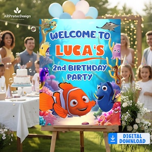 May include: A colorful birthday party sign featuring the text "WELCOME TO LUCA'S 2nd BIRTHDAY PARTY" with cartoon characters from the movie "Finding Nemo". The sign is on an easel with a digital download icon.