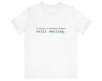 12 Hours. 0 Bathroom Breaks. Still Smiling. Tee | Funny Nurse Shirt | Nurse Gift (White & Heather)