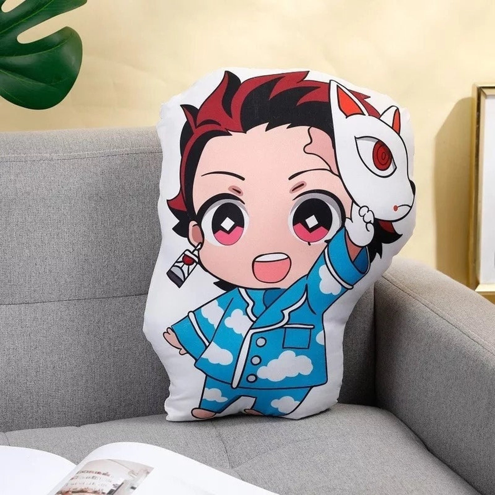 Tanjiro from Demon Slayer as a chibi character on a pillow