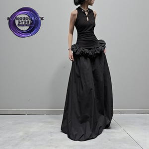 Women's Gothic Bodycon Maxi Dress | Sleeveless Ruffle Patchwork Gown | Elegant Vintage Grunge Y2K Fashion
.
A sleeveless women's bodycon maxi dress featuring ruffled patchwork details and a long flowing skirt, styled with gothic vintage and grunge Y2K fashion elements for an elegant, dark aesthetic.