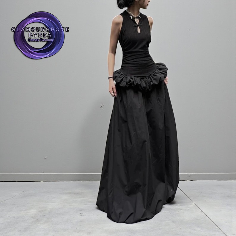Women's Gothic Bodycon Maxi Dress | Sleeveless Ruffle Patchwork Gown | Elegant Vintage Grunge Y2K Fashion
.
A sleeveless women's bodycon maxi dress featuring ruffled patchwork details and a long flowing skirt, styled with gothic vintage and grunge Y2K fashion elements for an elegant, dark aesthetic.