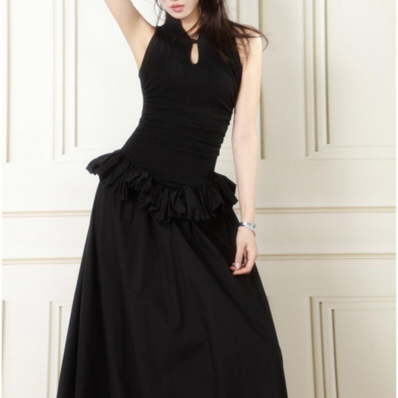 Women's Gothic Bodycon Maxi Dress | Sleeveless Ruffle Patchwork Gown | Elegant Vintage Grunge Y2K Fashion
.
A sleeveless women's bodycon maxi dress featuring ruffled patchwork details and a long flowing skirt, styled with gothic vintage and grunge Y2K fashion elements for an elegant, dark aesthetic.