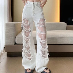 Women’s Ripped Denim Pants | Lace Straight Leg Trousers | Streetwear Style Outfit | Y2K Trend

Women’s ripped denim pants with loose-fit silhouette and straight-leg design suitable for streetwear outfits and everyday styling.