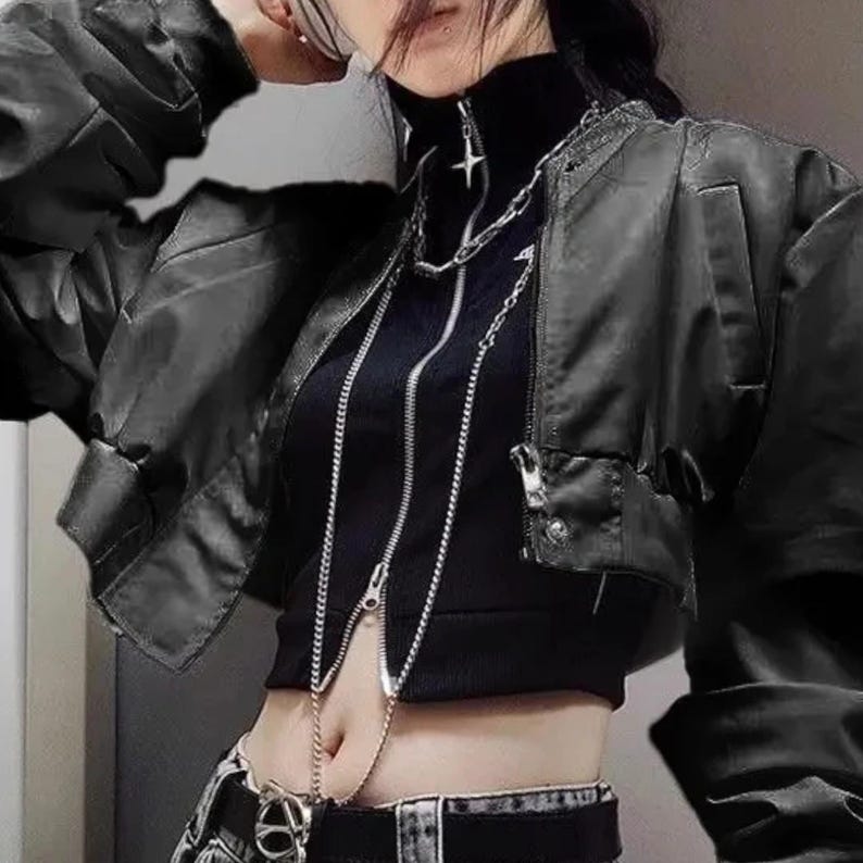 Women's Casual Retro Jacket | Long Sleeve Punk Alternative Coat | Gothic Vintage Y2k Fashion
.
Cropped gothic streetwear jacket for women with long sleeves and edgy punk Y2K fashion design, perfect for alternative outfits.