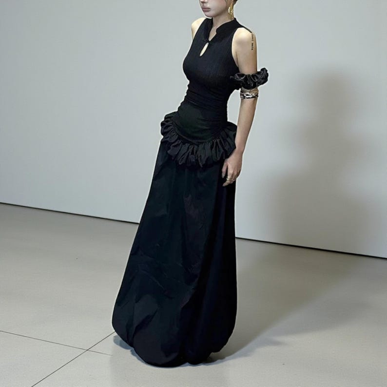 Women's Gothic Bodycon Maxi Dress | Sleeveless Ruffle Patchwork Gown | Elegant Vintage Grunge Y2K Fashion
.
A sleeveless women's bodycon maxi dress featuring ruffled patchwork details and a long flowing skirt, styled with gothic vintage and grunge Y2K fashion elements for an elegant, dark aesthetic.