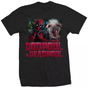 May include: Black t-shirt with a graphic of Deadpool and a dog. The image shows Deadpool in his red and black costume, with the dog next to him. The text "Dogpool & Deadpool" is printed in red.