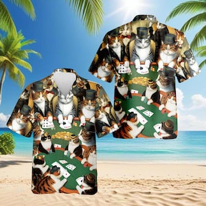 May include: Short-sleeved button-down shirt featuring a repeating pattern of cats playing poker. The cats are depicted in tuxedos and top hats, with poker chips and playing cards on a green felt table. The background shows a beach scene.