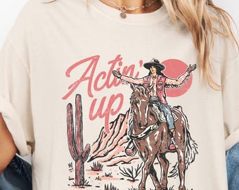 Actin' Up Cowgirl, chemise de rodéo, chemise country, t-shirt cowgirl rétro, t-shirt concert country, t-shirt graphique western pour femme, t-shirt western