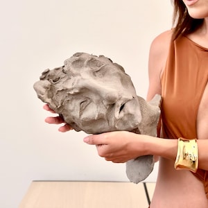 Strength in Silence – Handcrafted Clay Sculpture