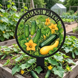 May include: A circular black metal garden sign with the text SQUASH PATCH at the top. The center features a colorful illustration of green cucumbers, a dark green zucchini, a yellow squash, and bright yellow blossoms with green leaves.
