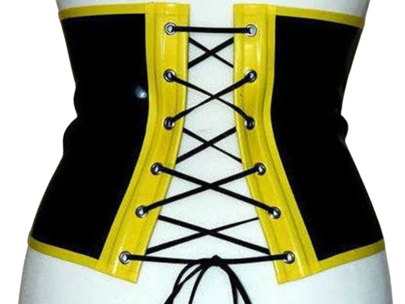 May include: Black and yellow latex corset with a lace-up back. The corset has a yellow trim and black laces.