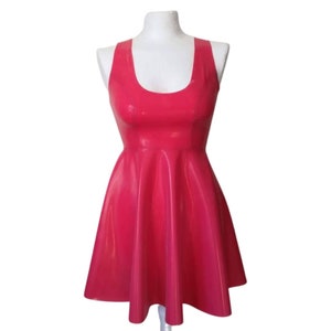 A sleeveless, pink latex dress with a scoop neck and a flared skirt.