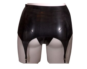 May include: Black rubber garter belt with three adjustable straps on each side. The garter belt is on a white mannequin.