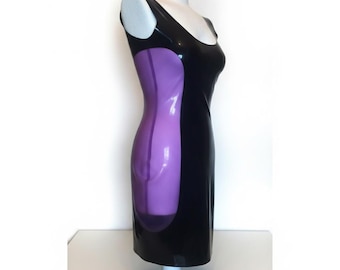 May include: A sleeveless dress made of a shiny black material featuring a contrasting vertical panel of translucent purple material along the side. The garment has a scoop neckline and a fitted silhouette, displayed on a white mannequin torso.