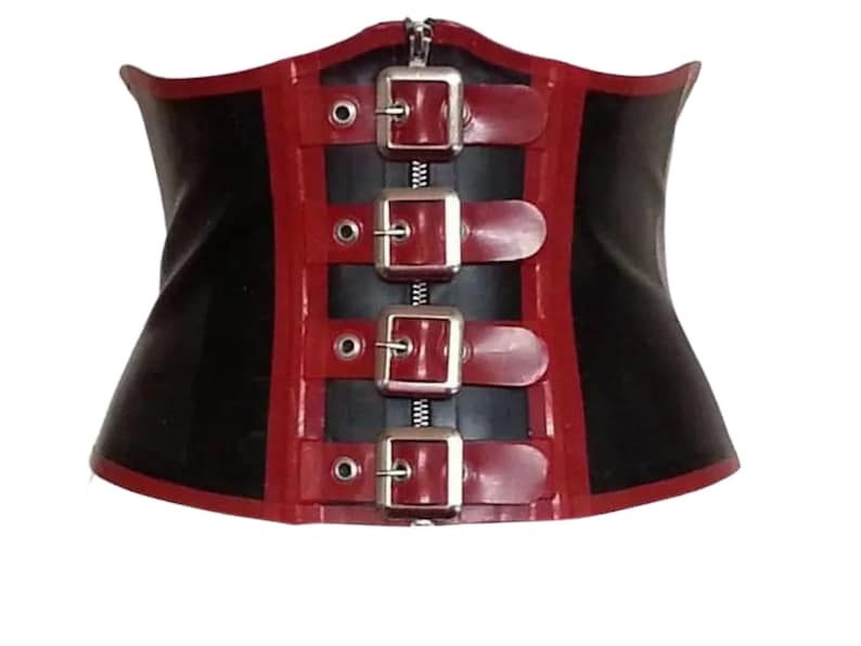 May include: A black latex corset with red trim and silver buckles. The corset has a zipper in the front.