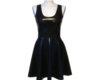 May include: A black sleeveless skater dress made of shiny latex.