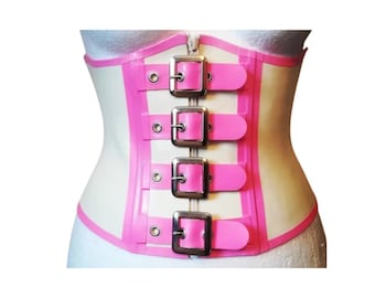 May include: A white latex corset with pink trim and four silver buckles. The corset has a zipper in the back.