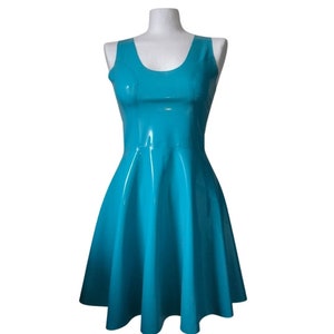 A sleeveless, turquoise latex dress with a scoop neck and a flared skirt.