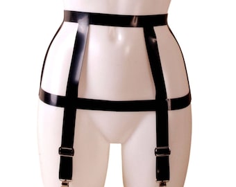 May include: Black elastic garter belt with four adjustable straps and silver clips.