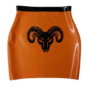 A short orange latex skirt with a black waistband and a black ram's head logo.